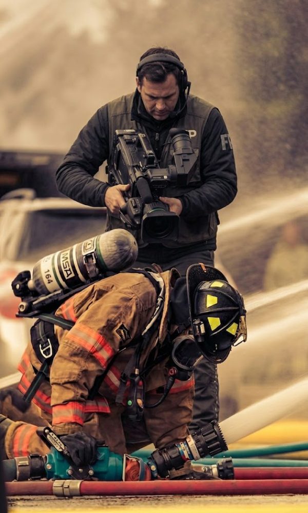Fireman filmed by videographer