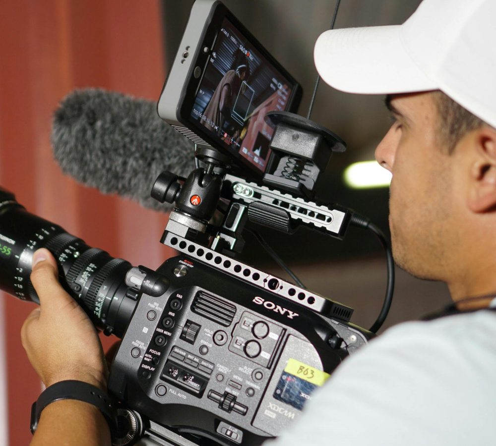 Event videographer filming corporate event